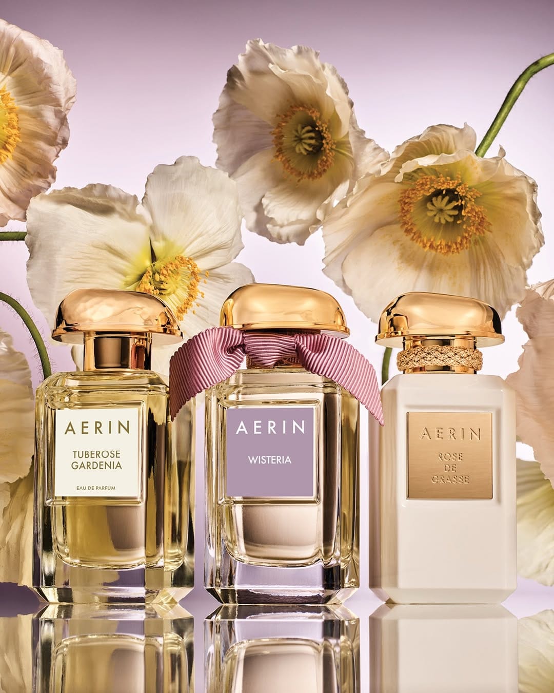 AERIN Beauty fragrance product photo: champagne gold, clear glass and ivory, glass, soft light