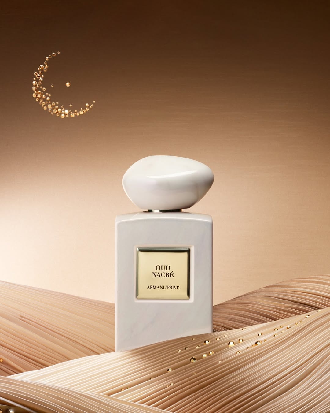 Armani Beauty Ramadan campaign product photo: ruby red, emerald green, jet black and gold, glass, studio light, image 2 of 3
