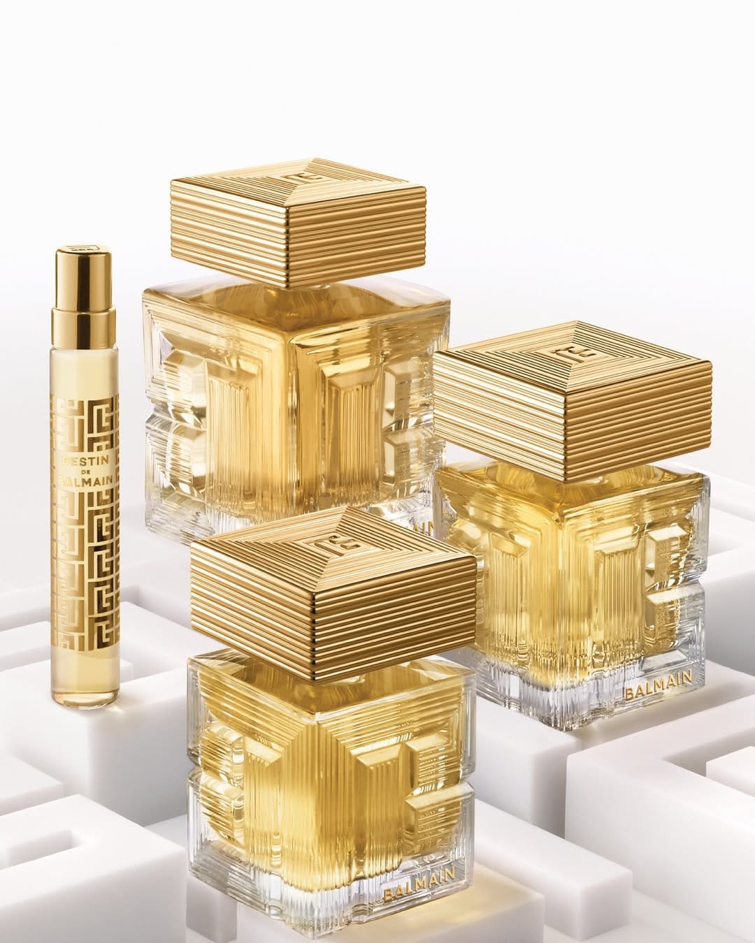 Balmain Beauty fragrance product photo: champagne gold, clear glass and warm gold, glass and metal, studio light, image 1 of 2