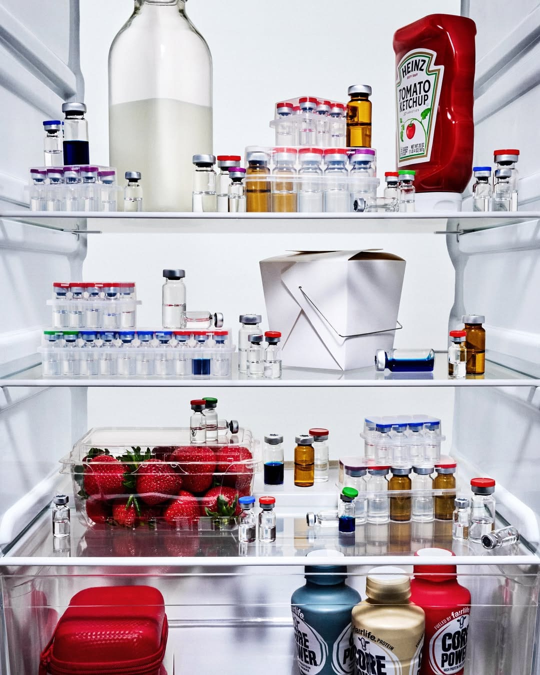 Bloomberg Businessweek peptide vials product photo: amber, black cap and clear glass, glass, studio light, image 2 of 2