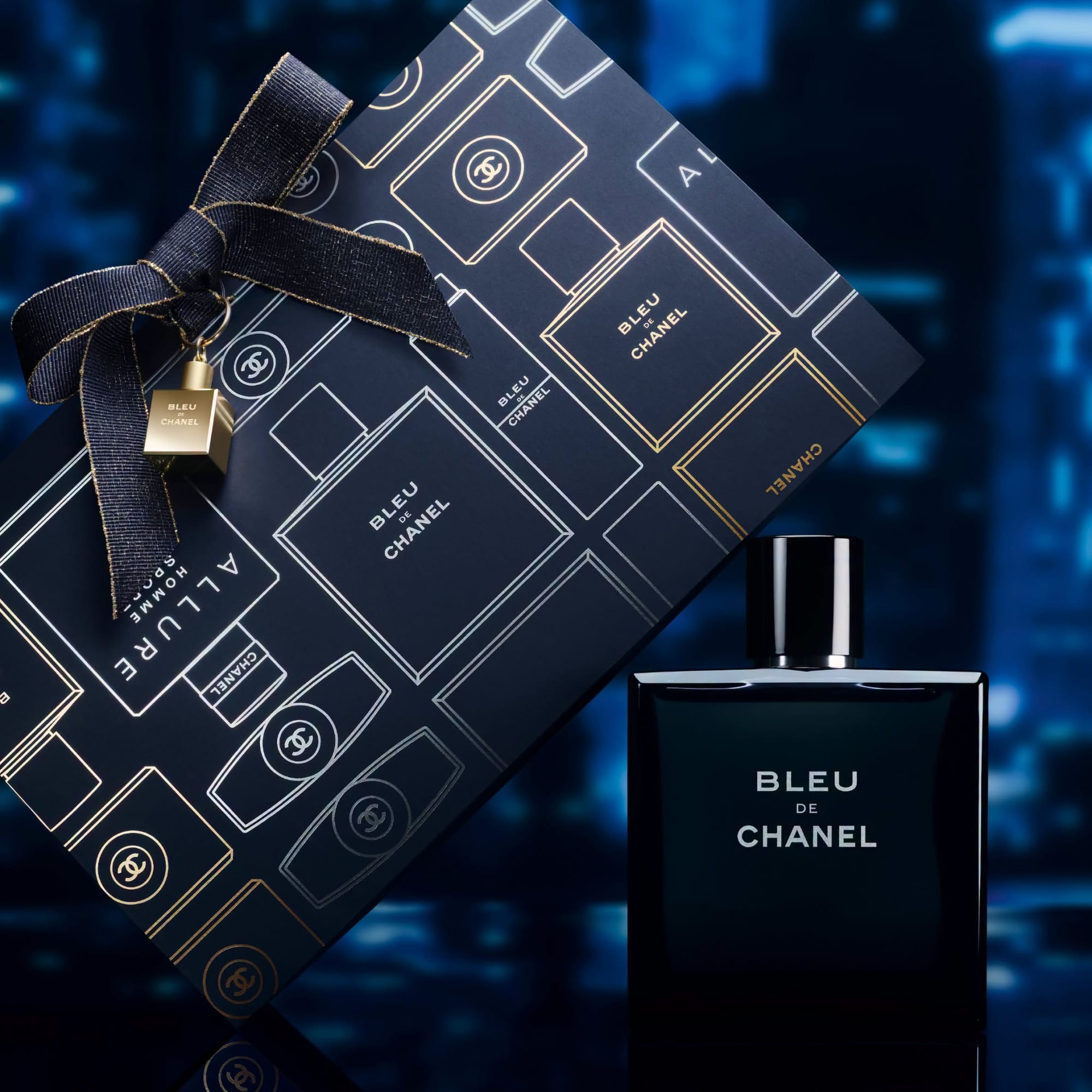 Chanel Bleu de Chanel product photo: midnight navy, black and brushed gold, glass, dramatic light