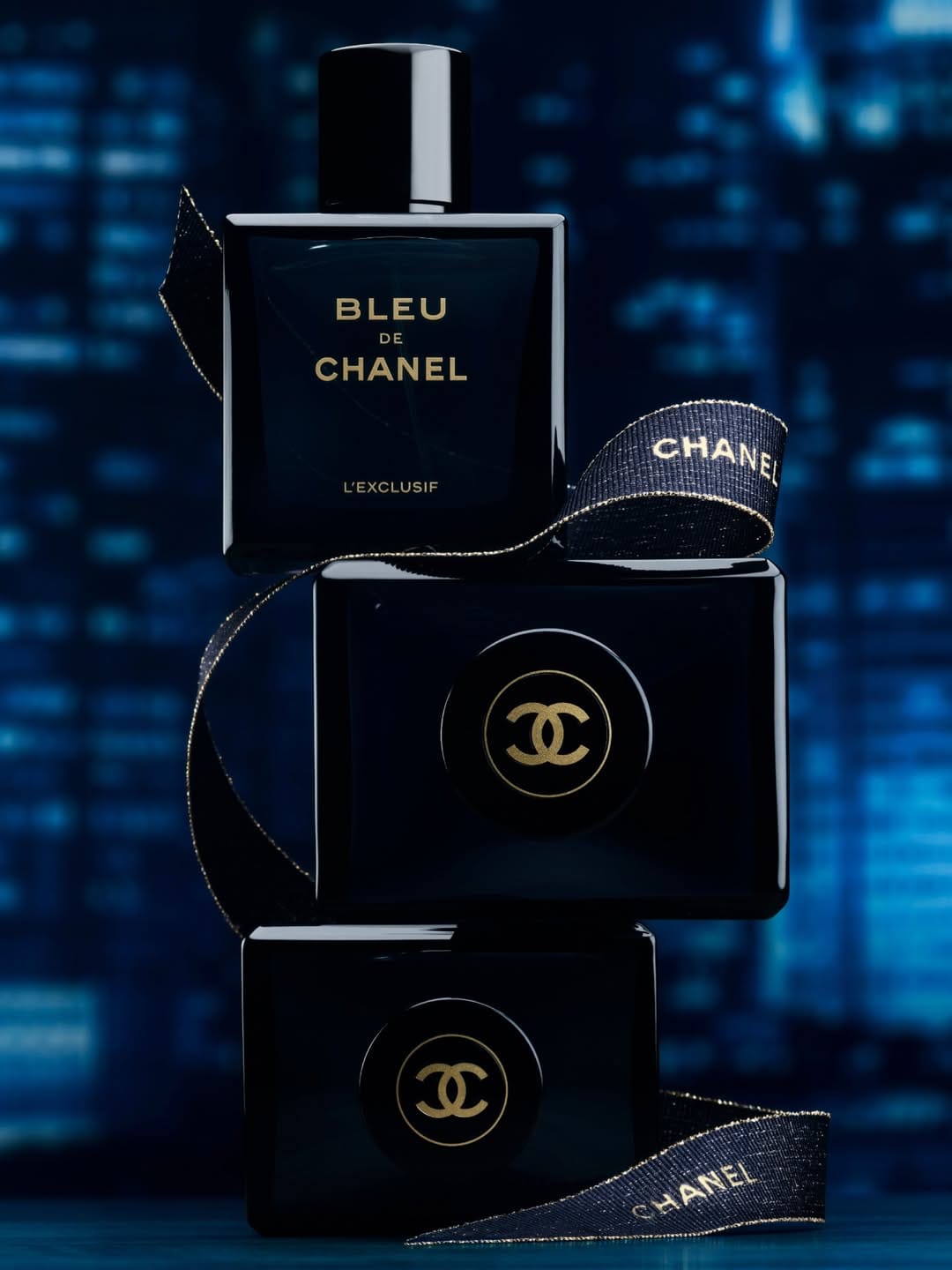 Chanel Bleu de Chanel product photo: midnight navy, black and brushed gold, glass, dramatic light, image 2 of 4
