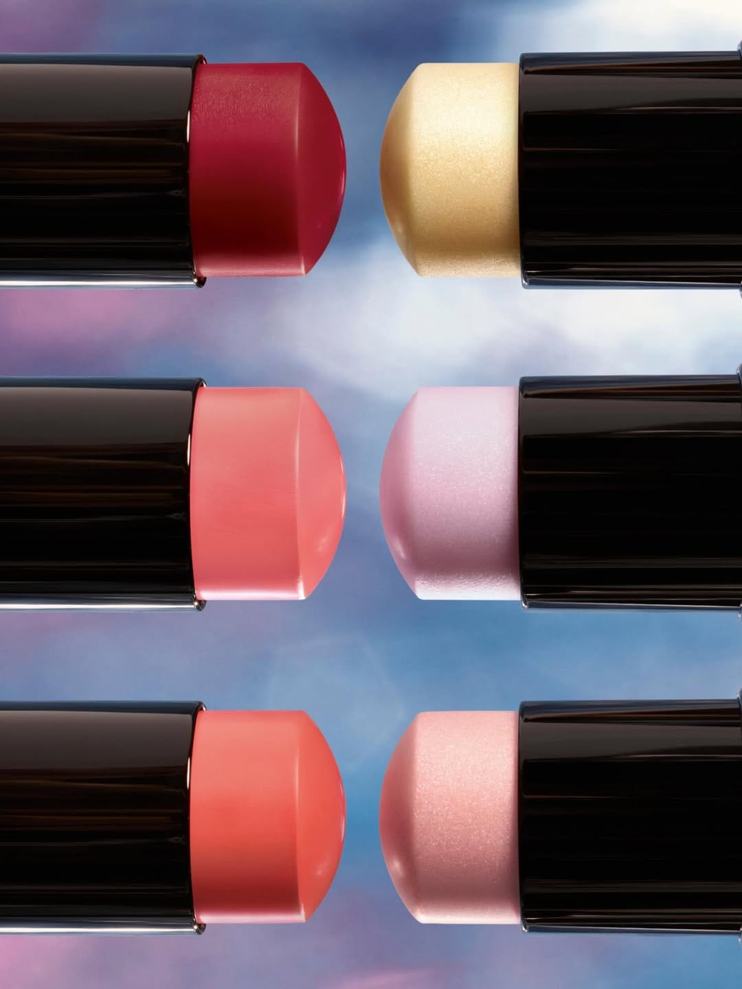 Chanel Duo de Baumes product photo: gloss black, burgundy, coral pink and gold band, plastic, dramatic light, image 3 of 4