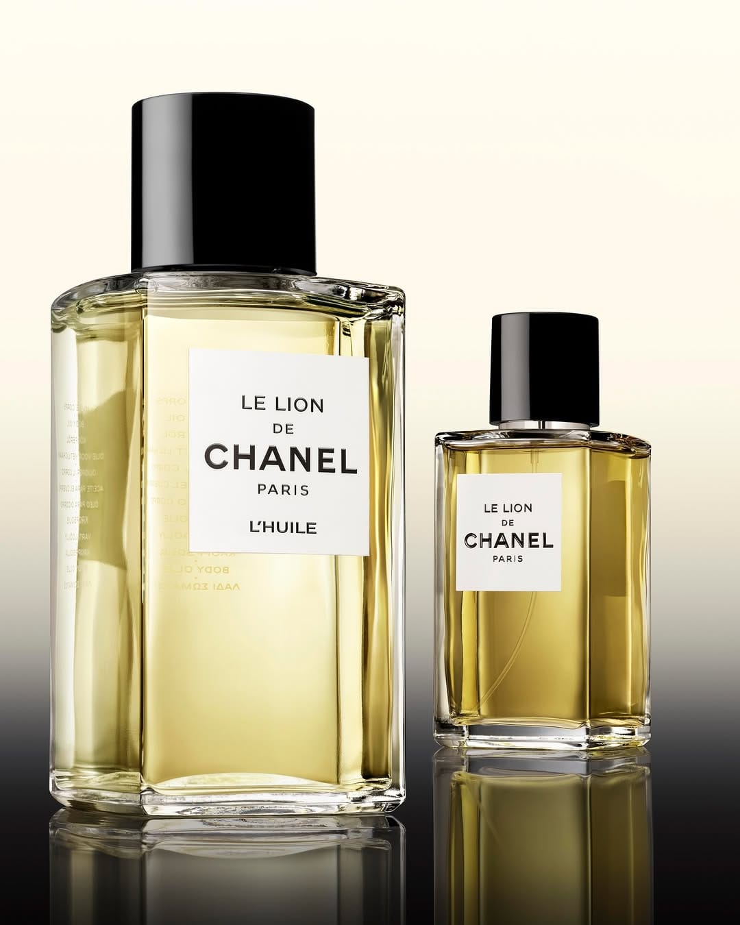 CHANEL Les Exclusifs product photo: pale gold, clear glass and black cap, glass, soft light, image 2 of 3
