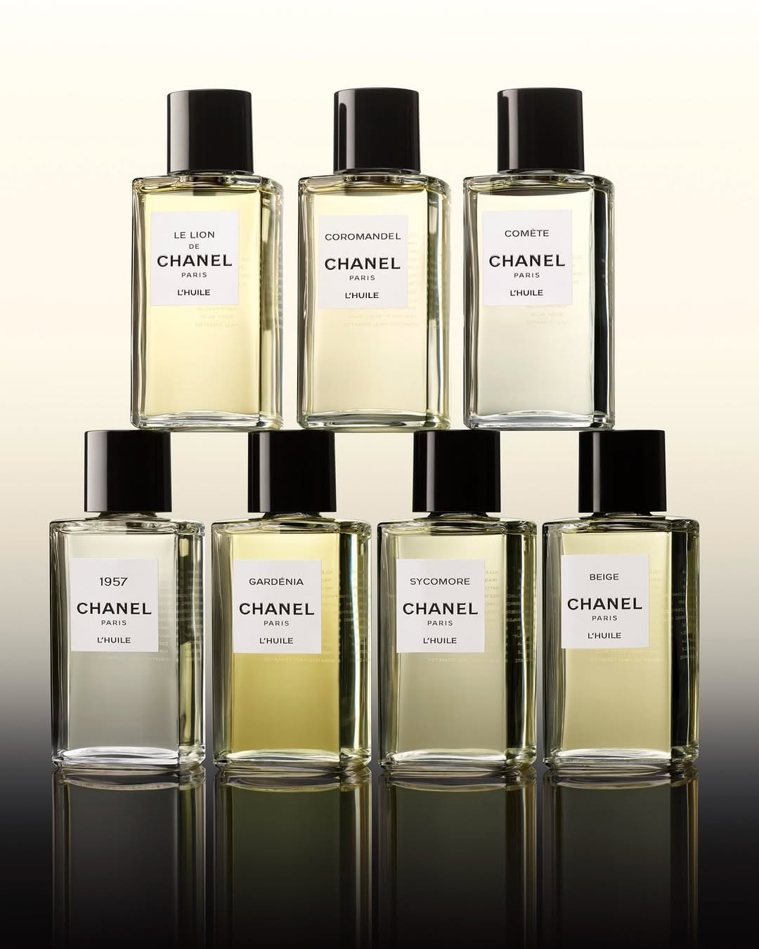 CHANEL Les Exclusifs product photo: pale gold, clear glass and black cap, glass, soft light, image 3 of 3
