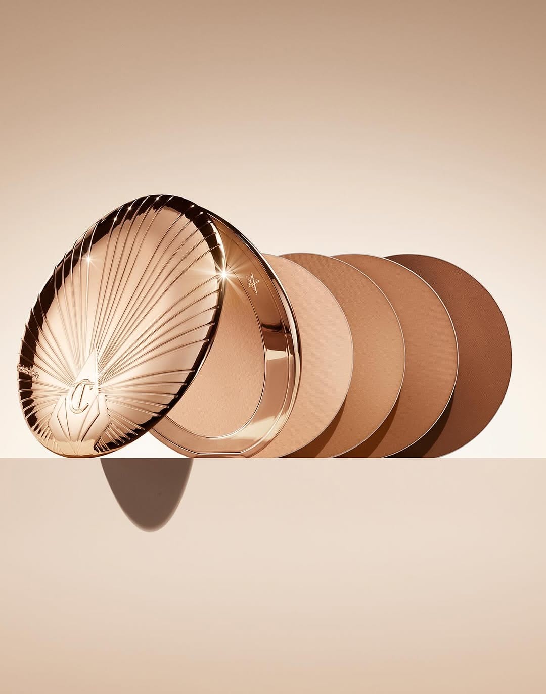 Charlotte Tilbury product photo: champagne beige, rose gold and bronze, metal, soft light, image 4 of 5