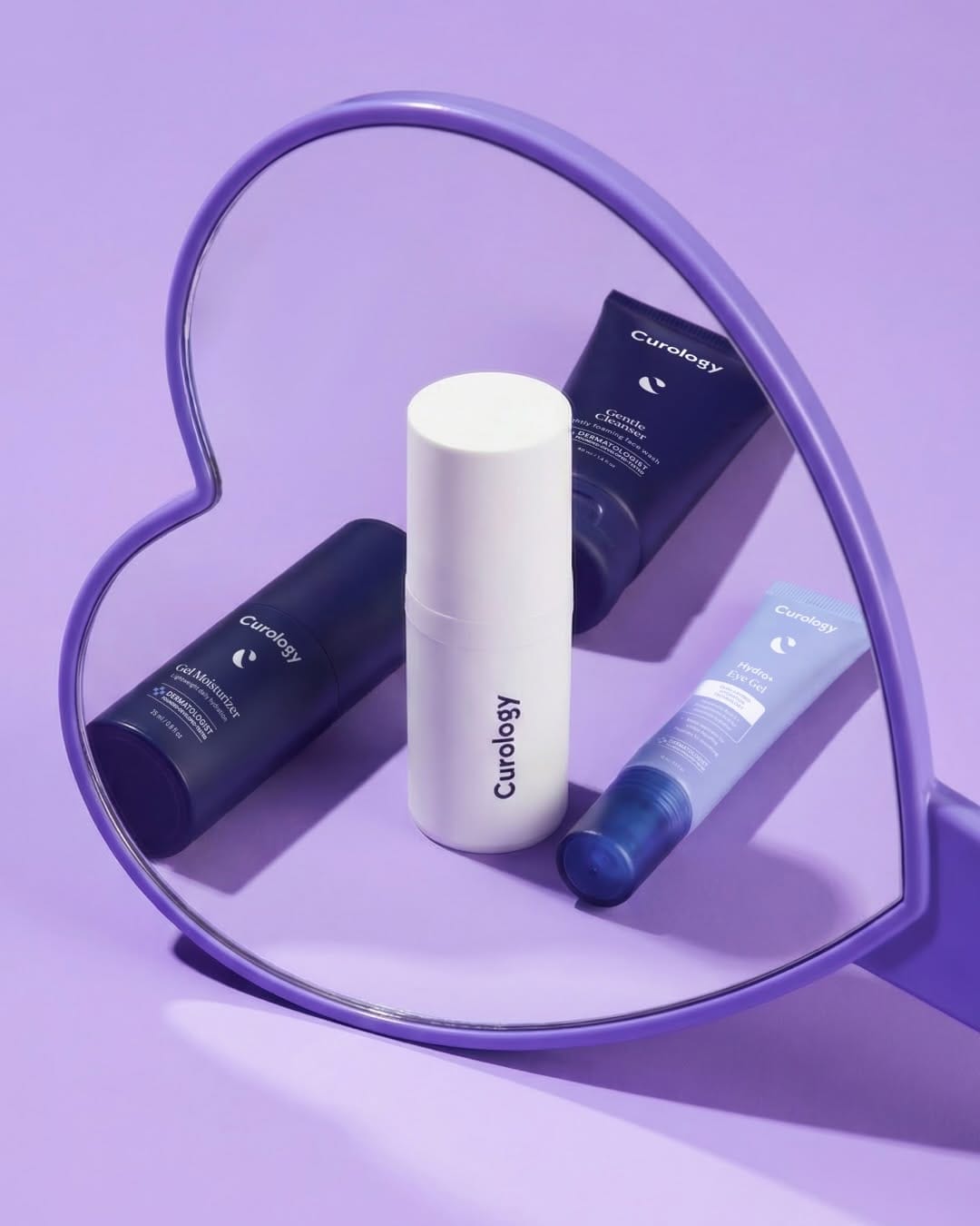 Curology's Valentine campaign product photo: lavender, white and navy, plastic, soft light