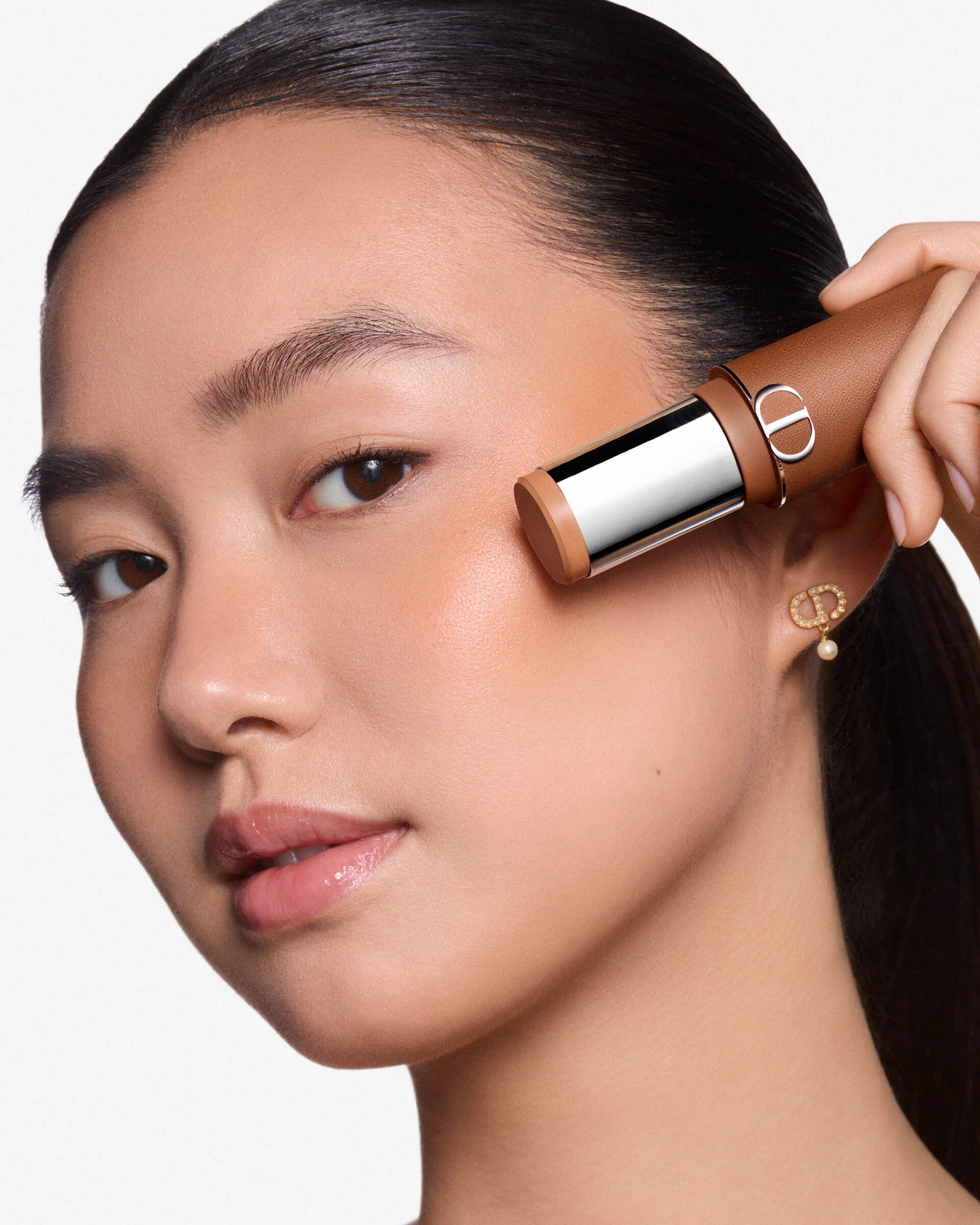 Dior Forever product photo: bronze, chrome silver and black, leather, soft light, image 4 of 5