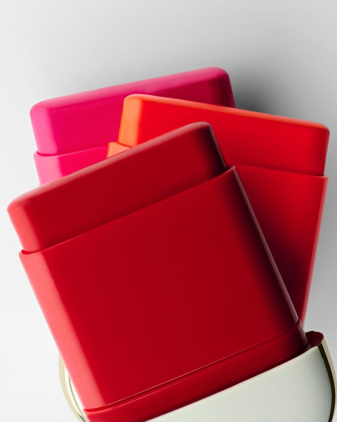 Dolce&Gabbana Beauty product photo: cherry red, hot pink and coral orange, plastic, studio light, image 2 of 3