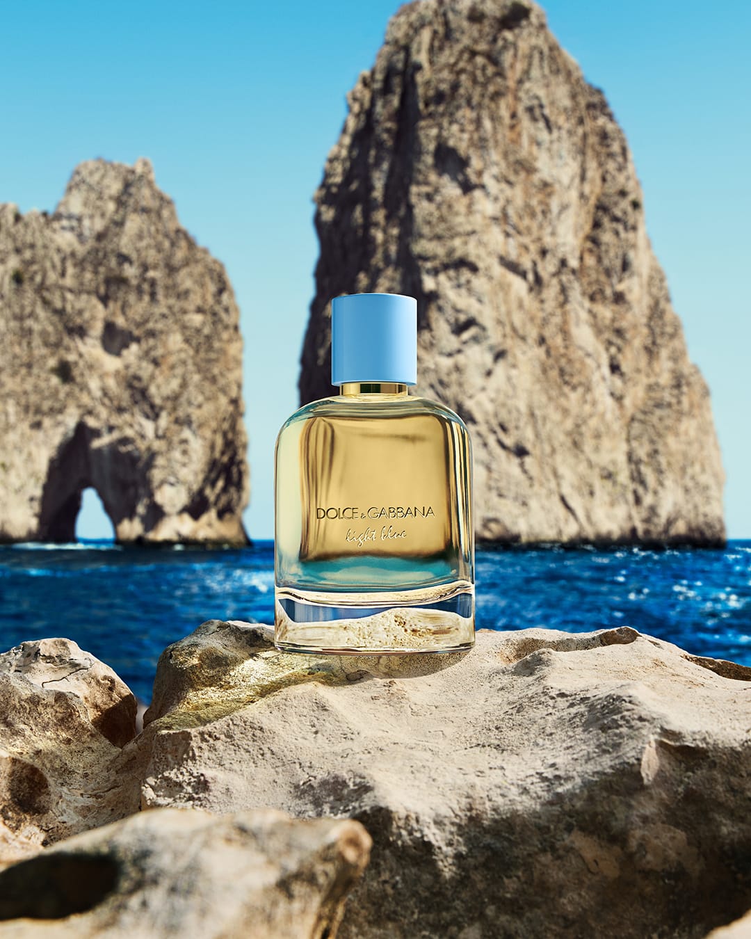 Dolce&Gabbana Light Blue product photo: sky blue, golden amber and clear glass, glass and stone, natural light, image 1 of 2