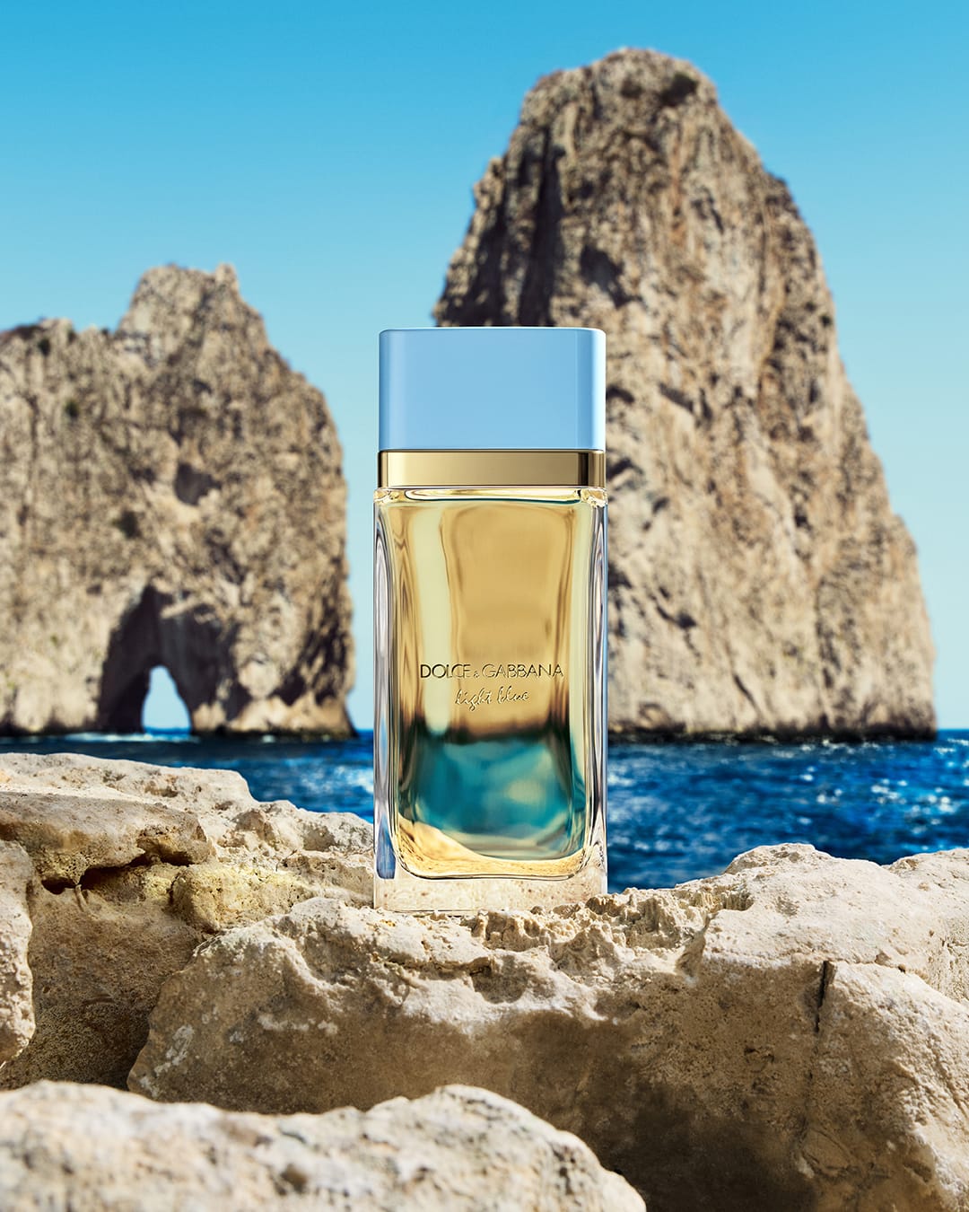 Dolce&Gabbana Light Blue product photo: sky blue, golden amber and clear glass, glass and stone, natural light, image 2 of 2