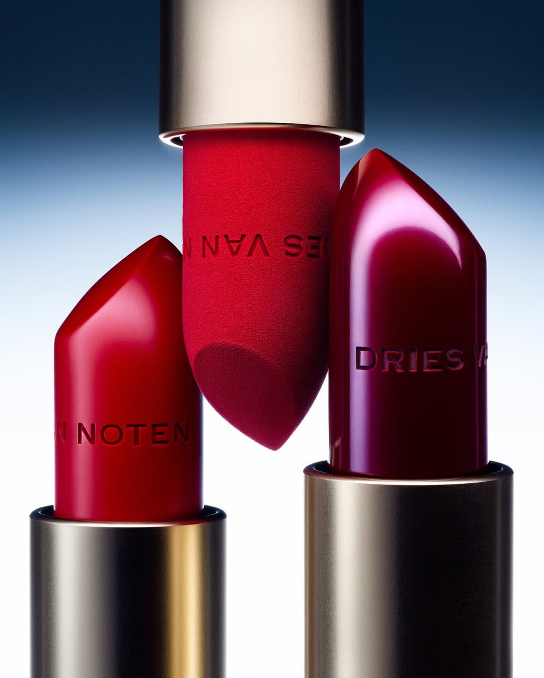 Dries Van Noten lipstick product photo: lipstick red, burnished gold and magenta berry, metal, studio light, image 4 of 6