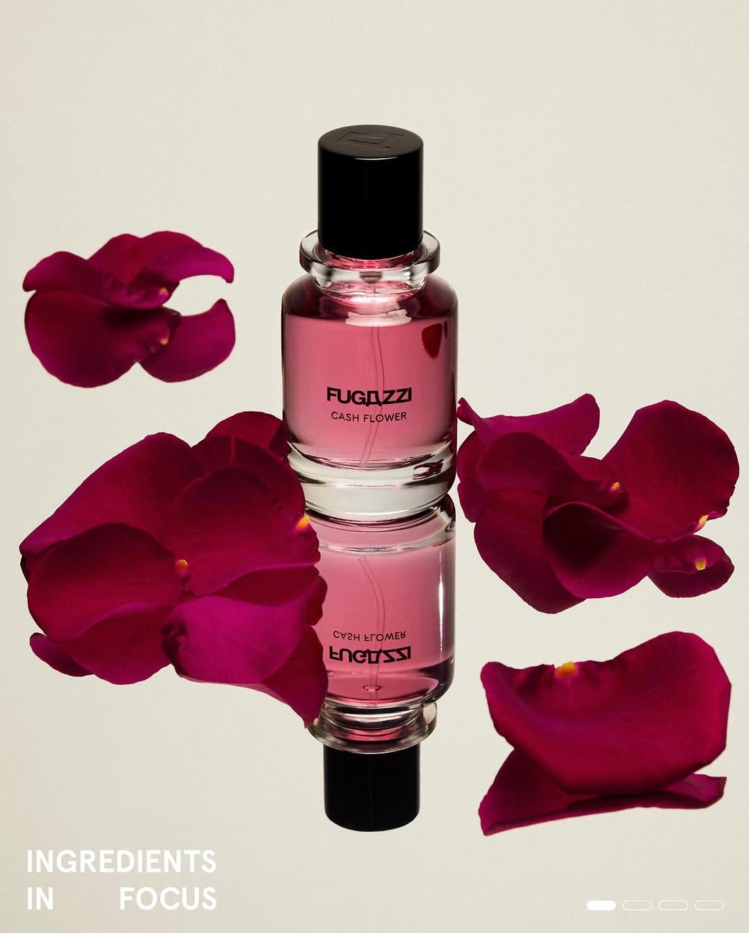 Fugazzi fragrance product photo: rose pink and black cap, glass, soft light