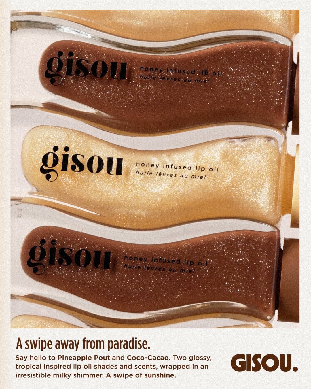 Gisou Tropical Honey Lip Oils product photo: cocoa brown, honey gold and clear glass, glass, soft light, image 4 of 9