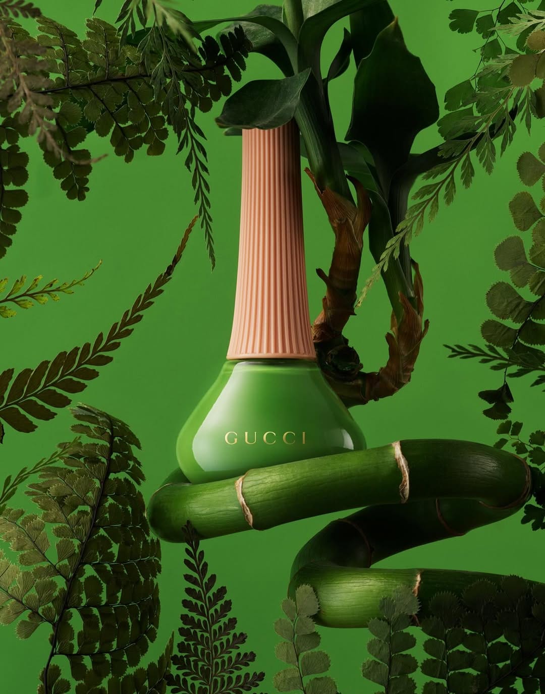 Gucci nail polish product photo: emerald green and peach cap, glass and organic, studio light, image 1 of 2