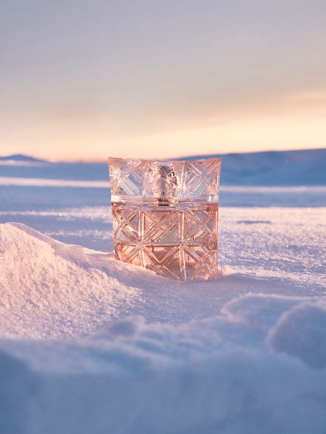 Issey Miyake Parfums product photo: clear glass and blush pink, glass, natural light, image 1 of 2