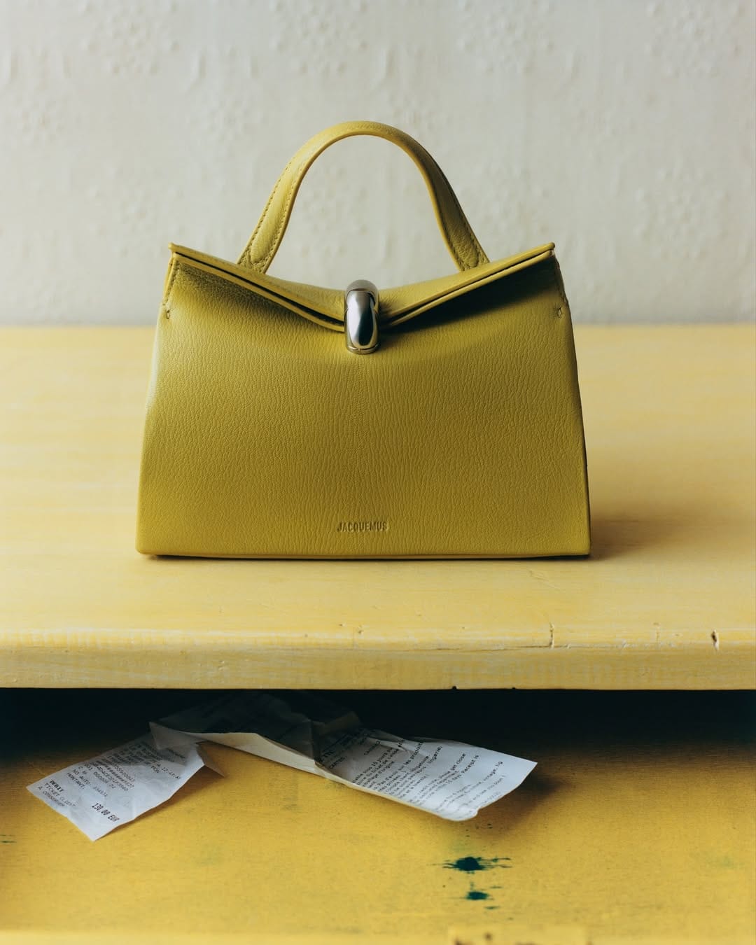 Jacquemus Le Paysan product photo: rust and mustard, fabric, natural light, image 3 of 4
