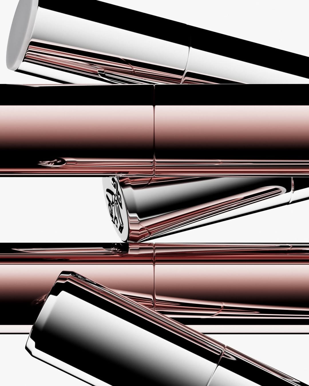 Lancôme lip balm product photo: chrome silver, black and lipstick red, metal, studio light, image 1 of 3