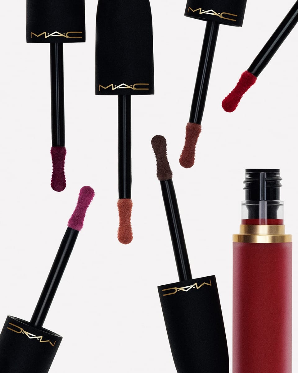 MAC Cosmetics lipsticks product photo: black, brick red and gold, plastic, studio light