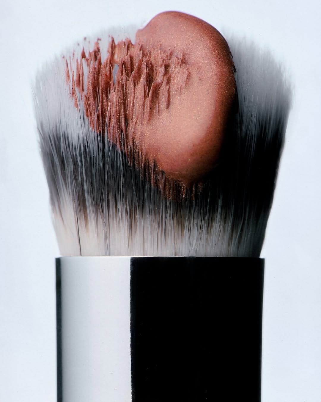Mecca Cosmetica product photo: chrome silver, black, berry pink and rosewood, metal, studio light, image 2 of 6