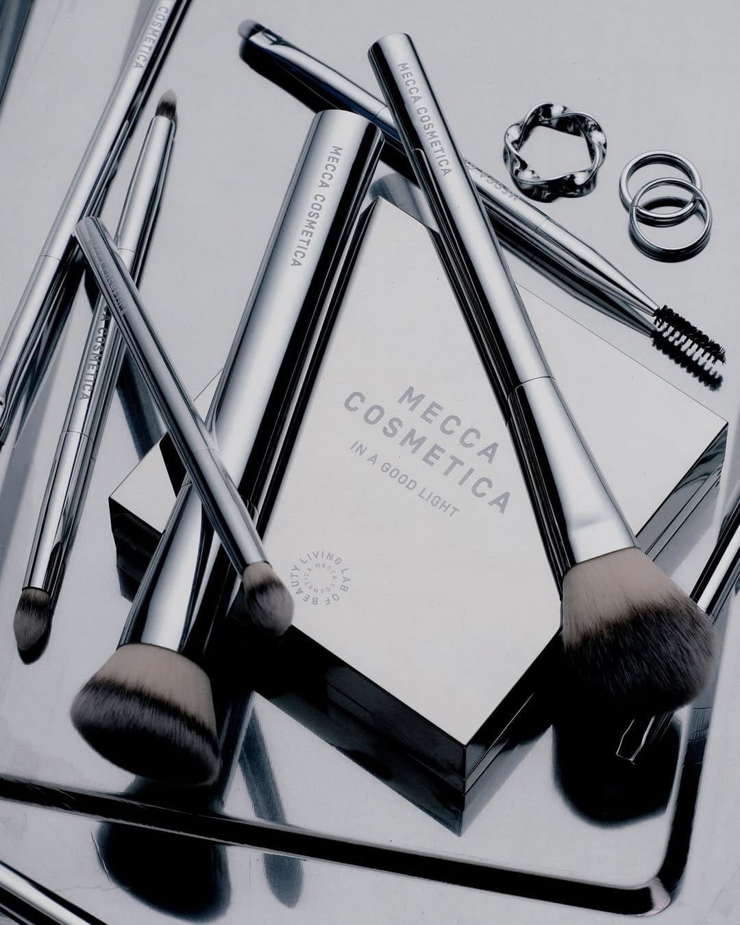 Mecca Cosmetica product photo: chrome silver, black, berry pink and rosewood, metal, studio light, image 3 of 6