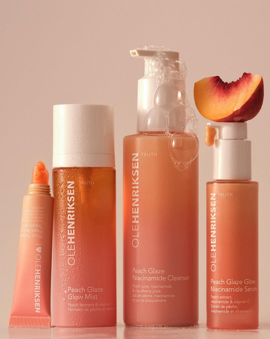 OLEHENRIKSEN Peach Glaze product photo: peach, coral pink and white, plastic and organic, soft light, image 2 of 4