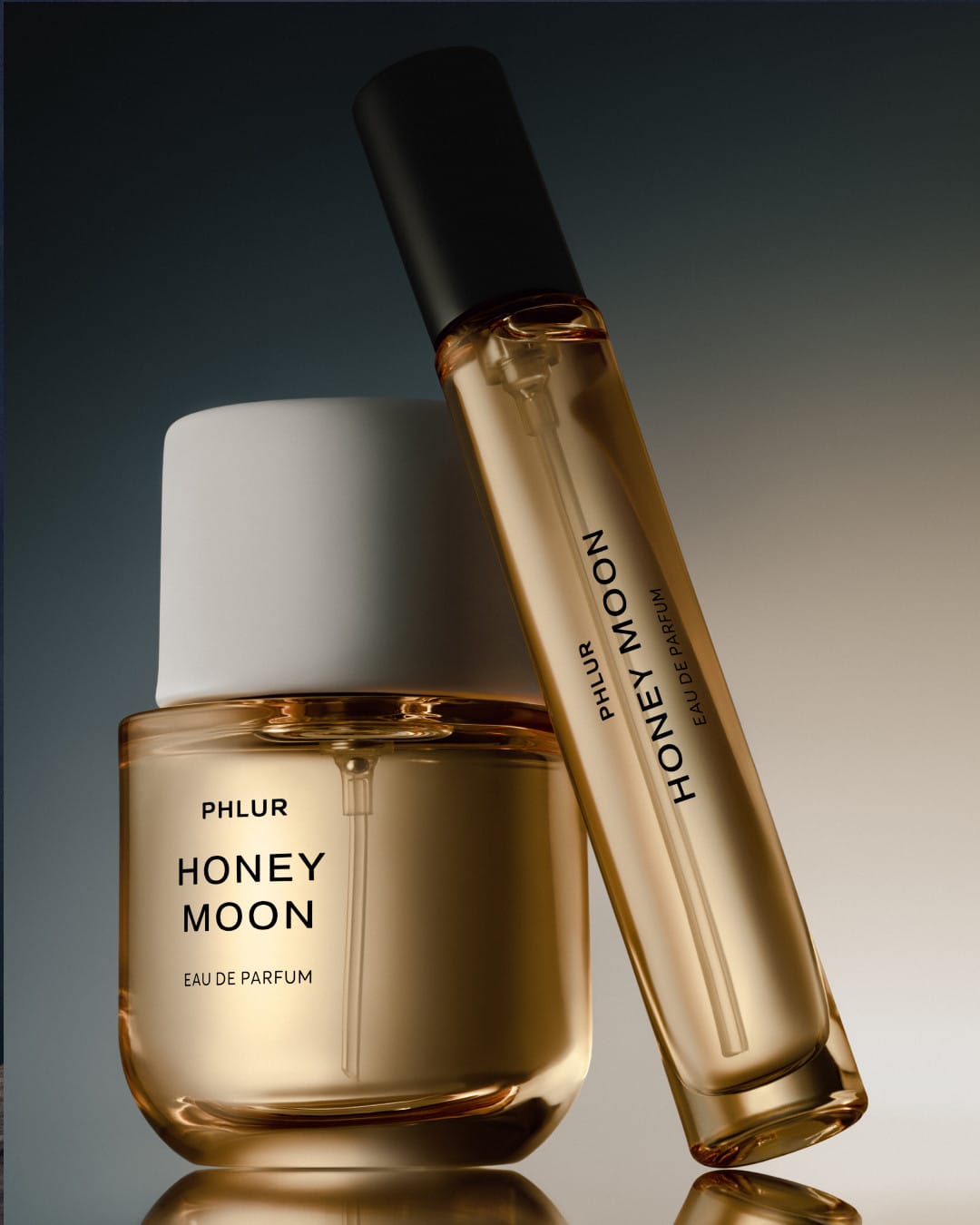 PHLUR's Honey Moon product photo: honey gold, cream white and black, glass and organic, dramatic light, image 2 of 2