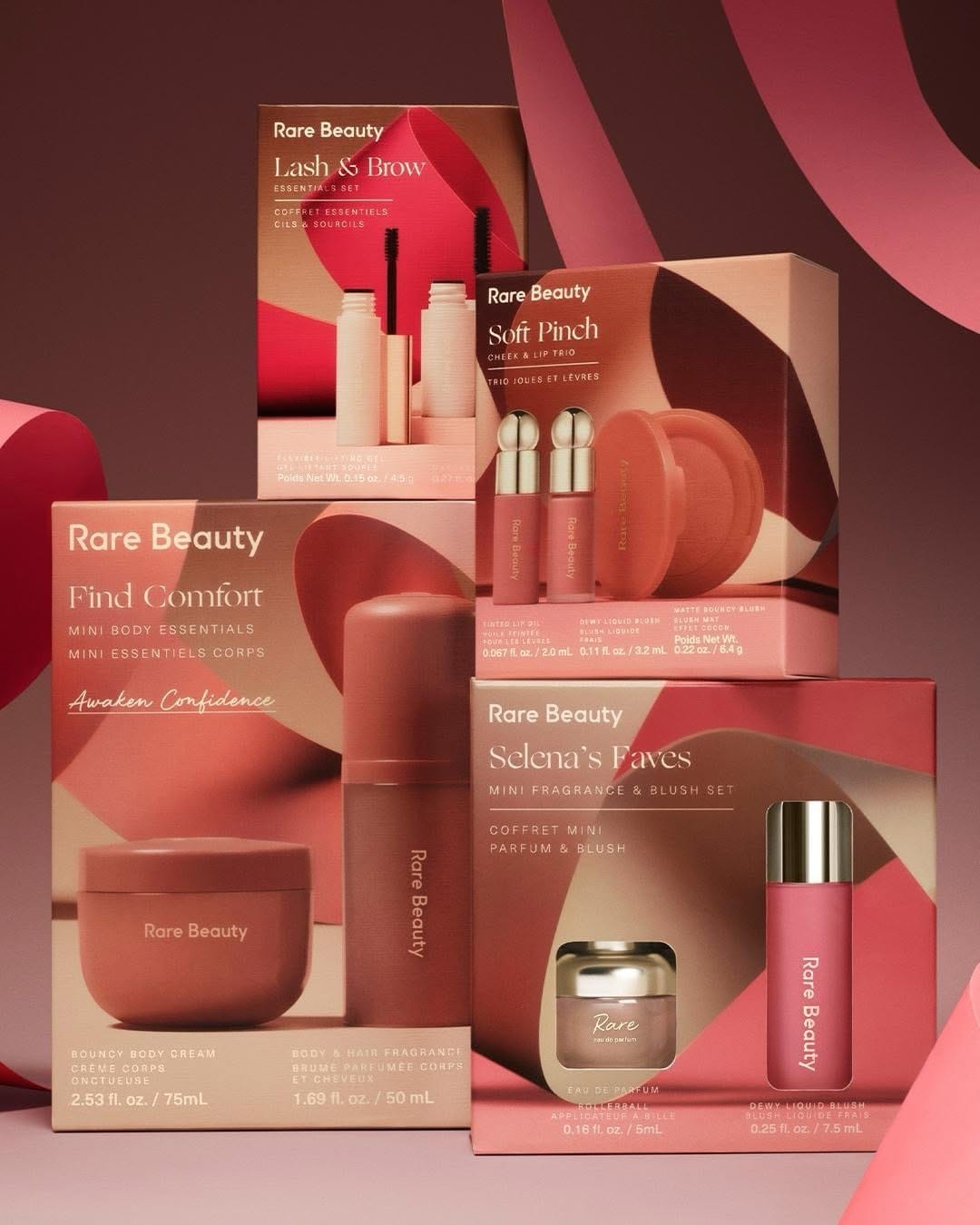 Rare Beauty product photo: coral red, rose pink, cream and gold, paper, soft light, image 1 of 6