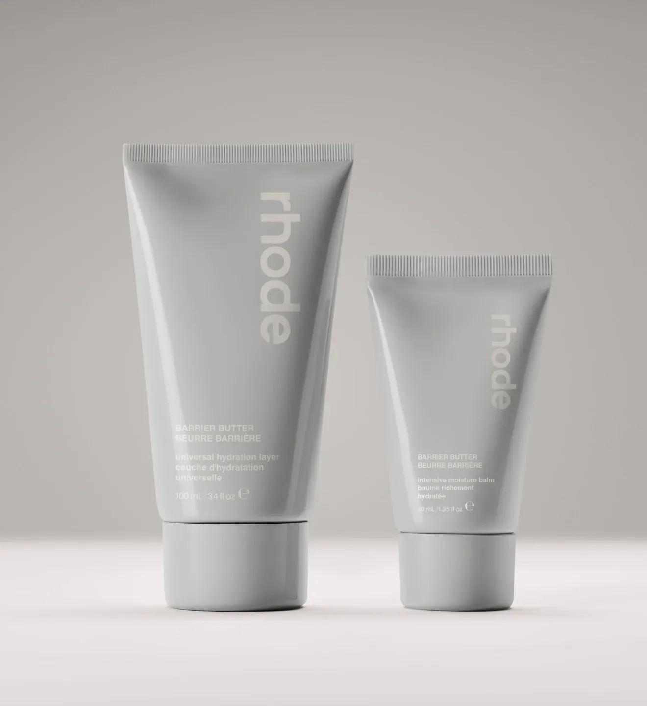 Rhode Skin product photo: warm grey and cream white, plastic, soft light, image 3 of 3