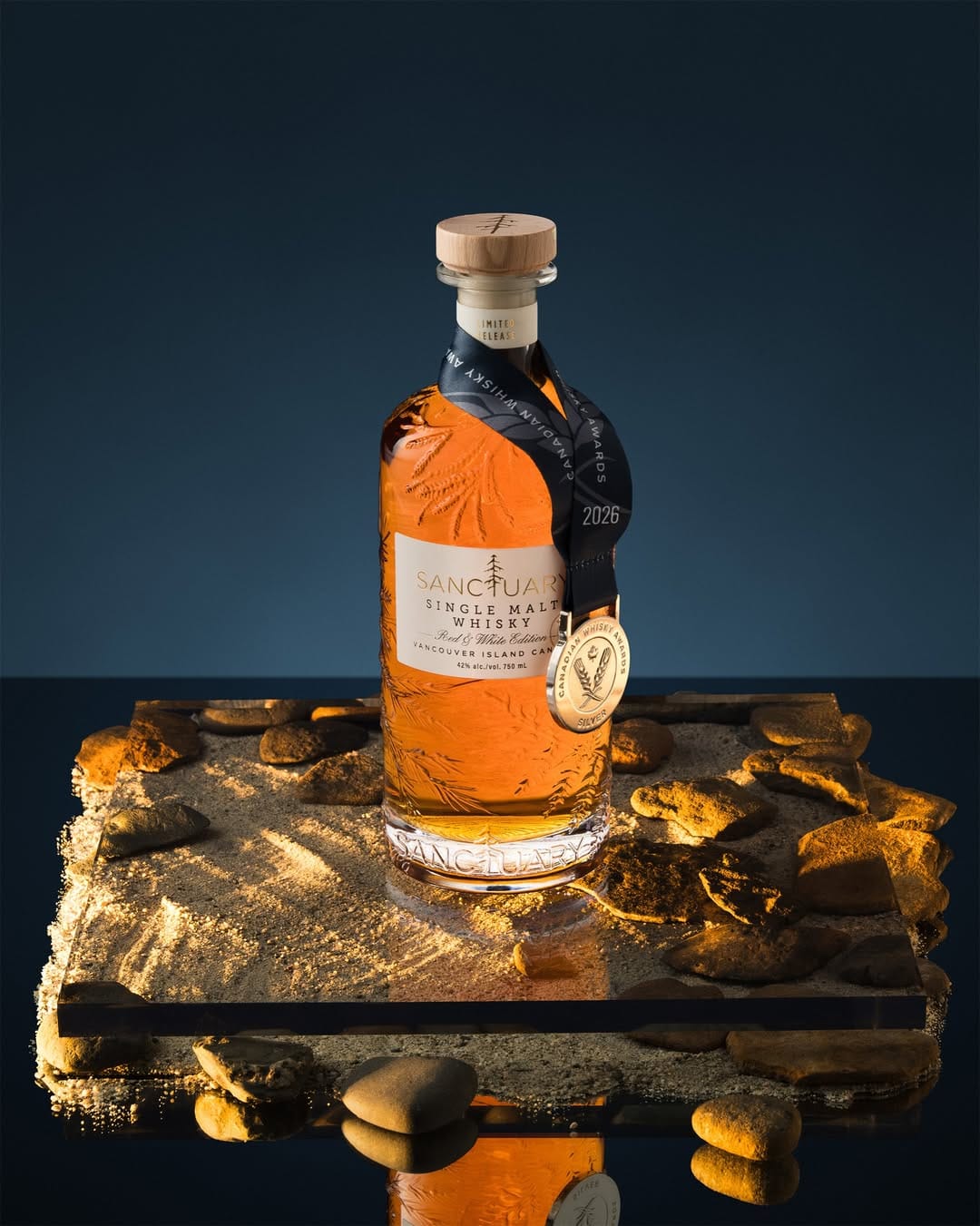 Sanctuary Whisky product photo: amber whisky, dark honey and cork, glass and stone, dramatic light, image 1 of 2