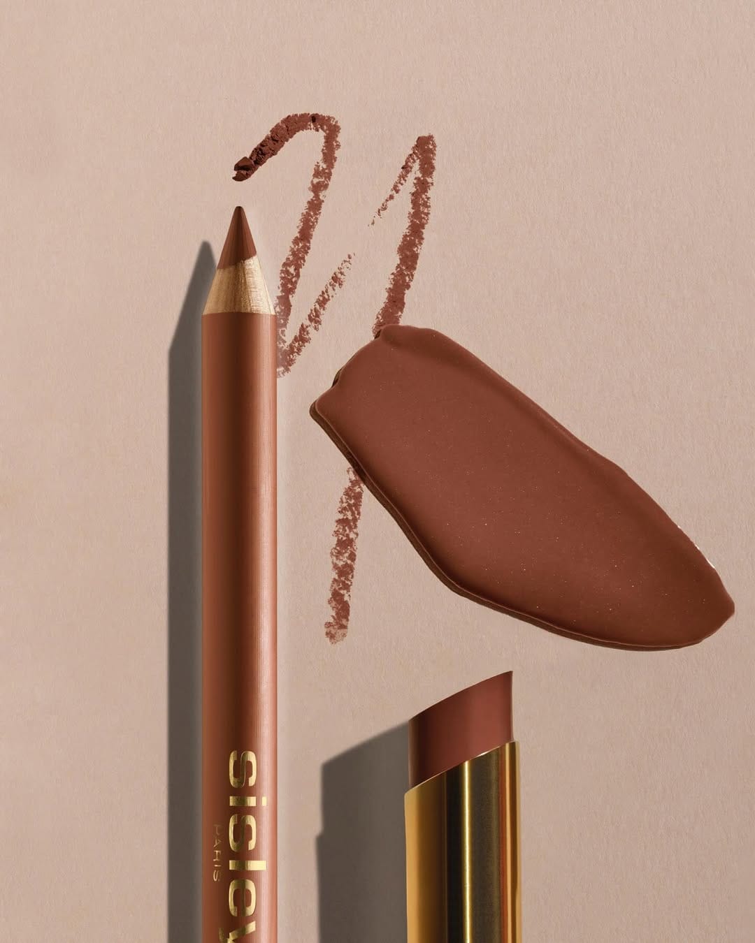 Sisley Paris lipstick product photo: gold, poppy red, chocolate brown and rosewood, metal, soft light, image 5 of 6