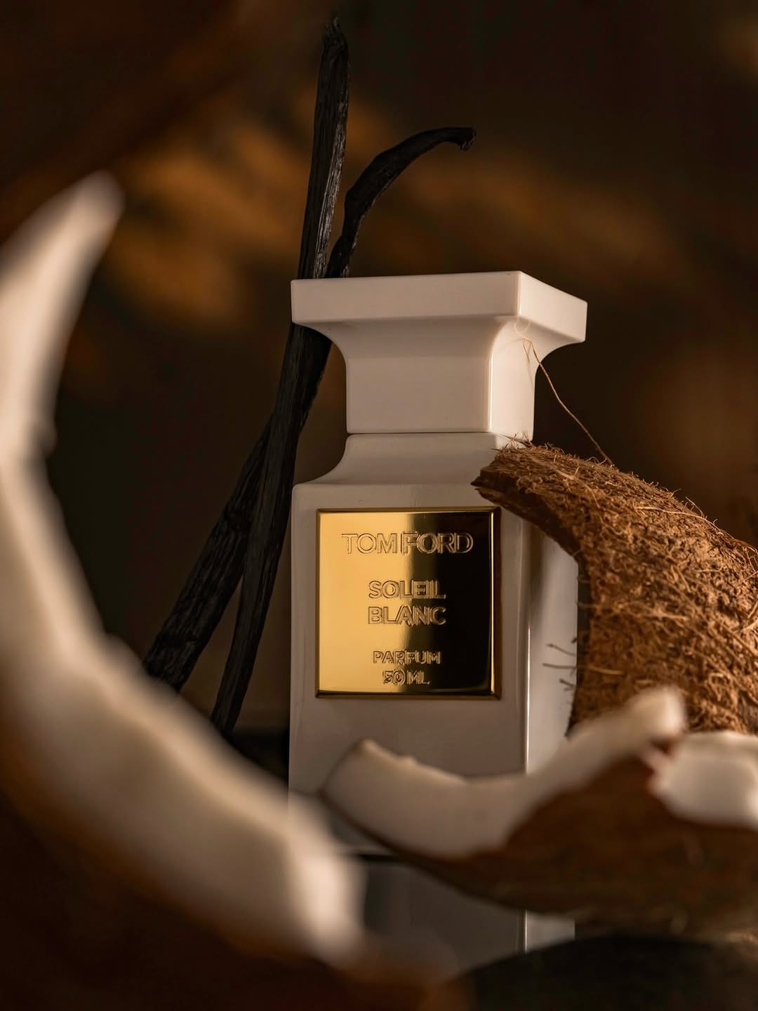Tom Ford fragrance photography product photo: ivory white, brushed gold and espresso, glass and organic, dramatic light