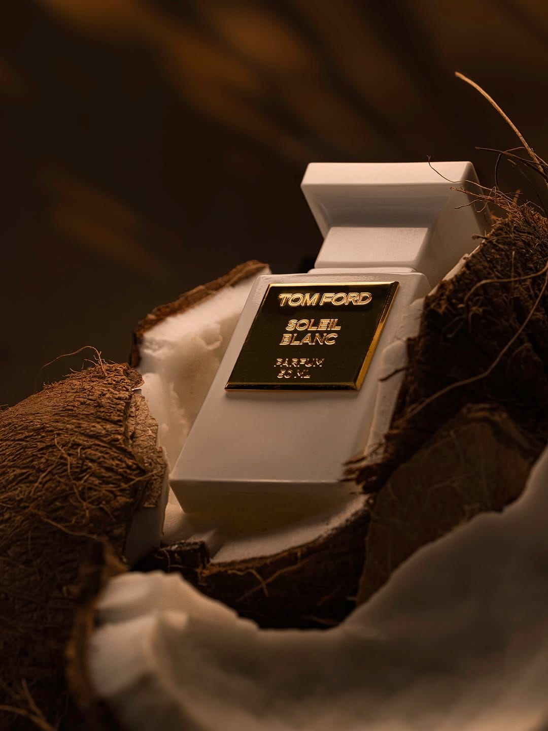 Tom Ford fragrance photography product photo: ivory white, brushed gold and espresso, glass and organic, dramatic light, image 3 of 9