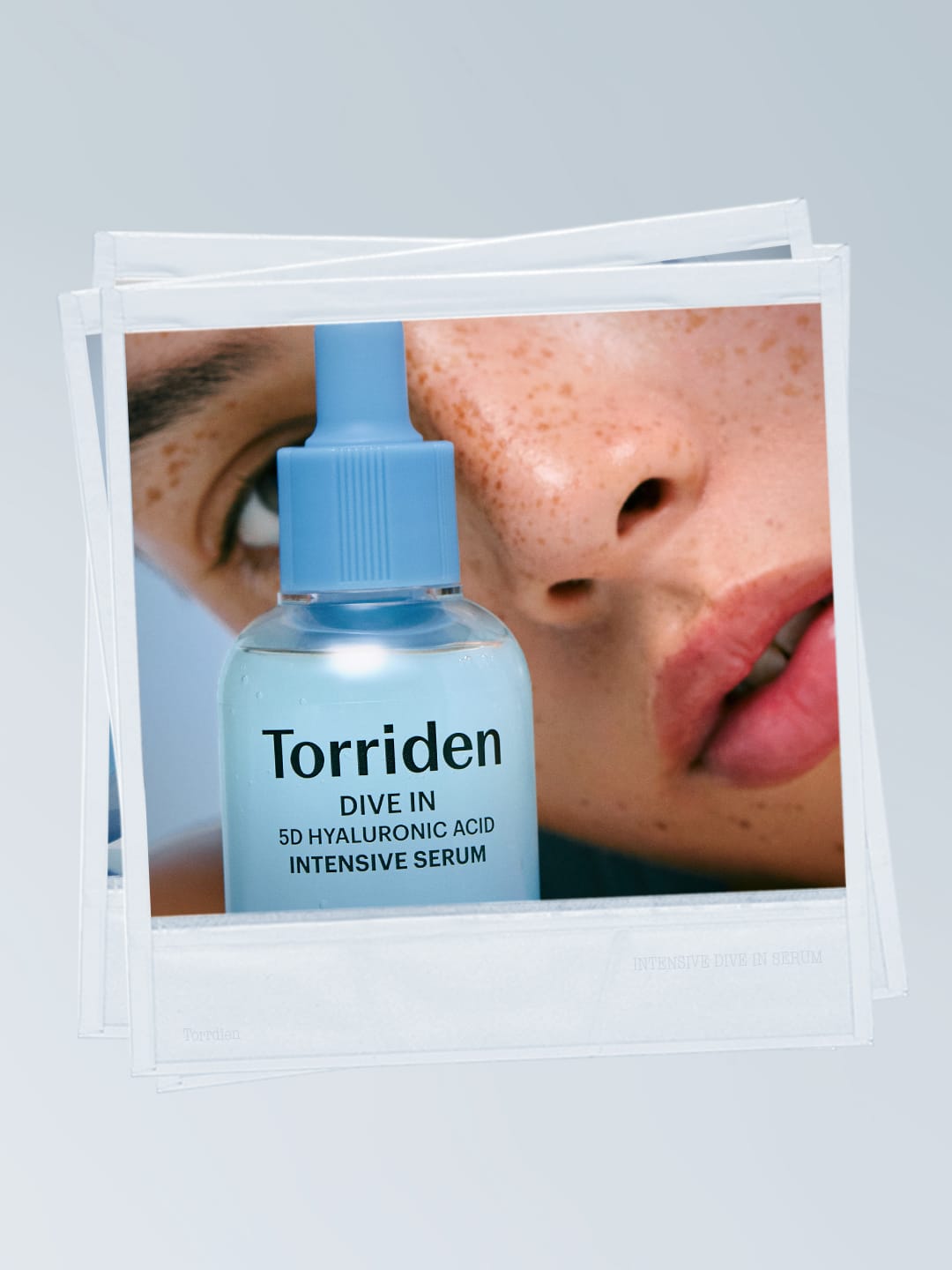 Torriden skincare product photo: hyaluronic blue and frosted clear, glass, soft light, image 2 of 6