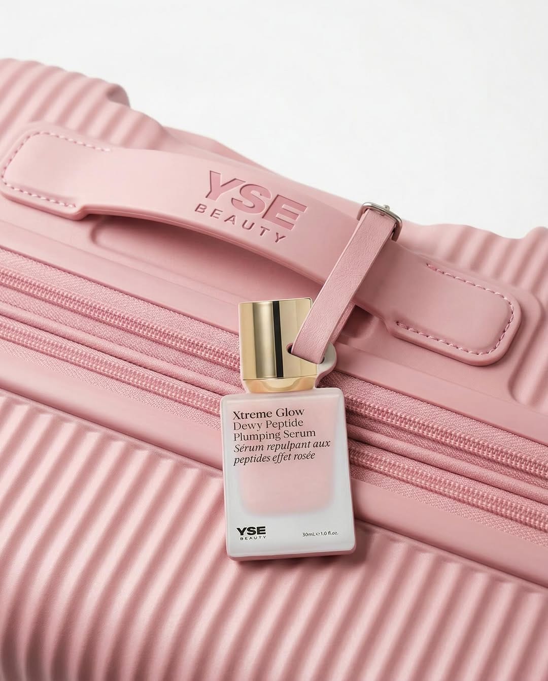 YSE Beauty's glow serum product photo: blush pink, gold cap and white, glass, natural light, image 4 of 9