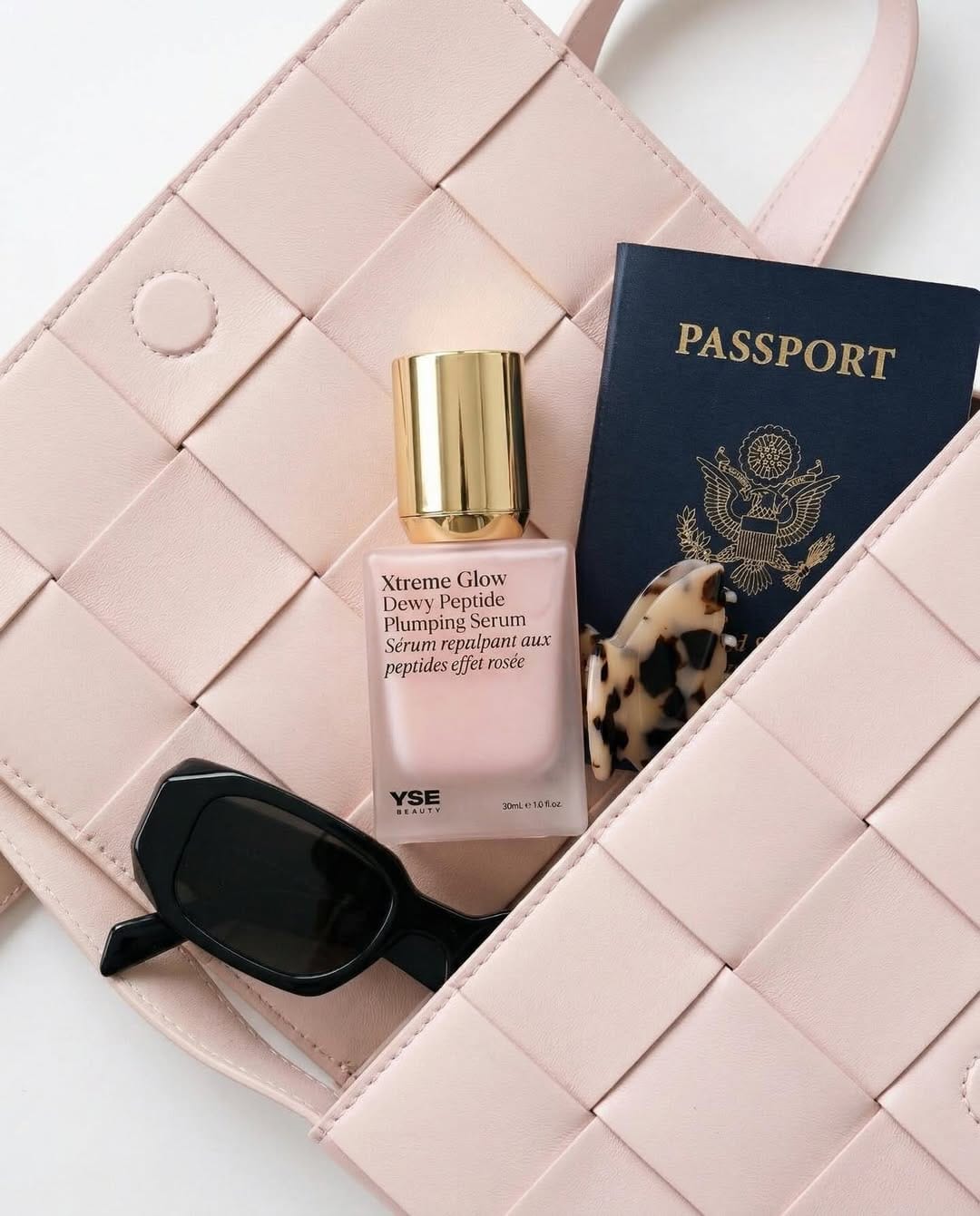 YSE Beauty's glow serum product photo: blush pink, gold cap and white, glass, natural light, image 6 of 9