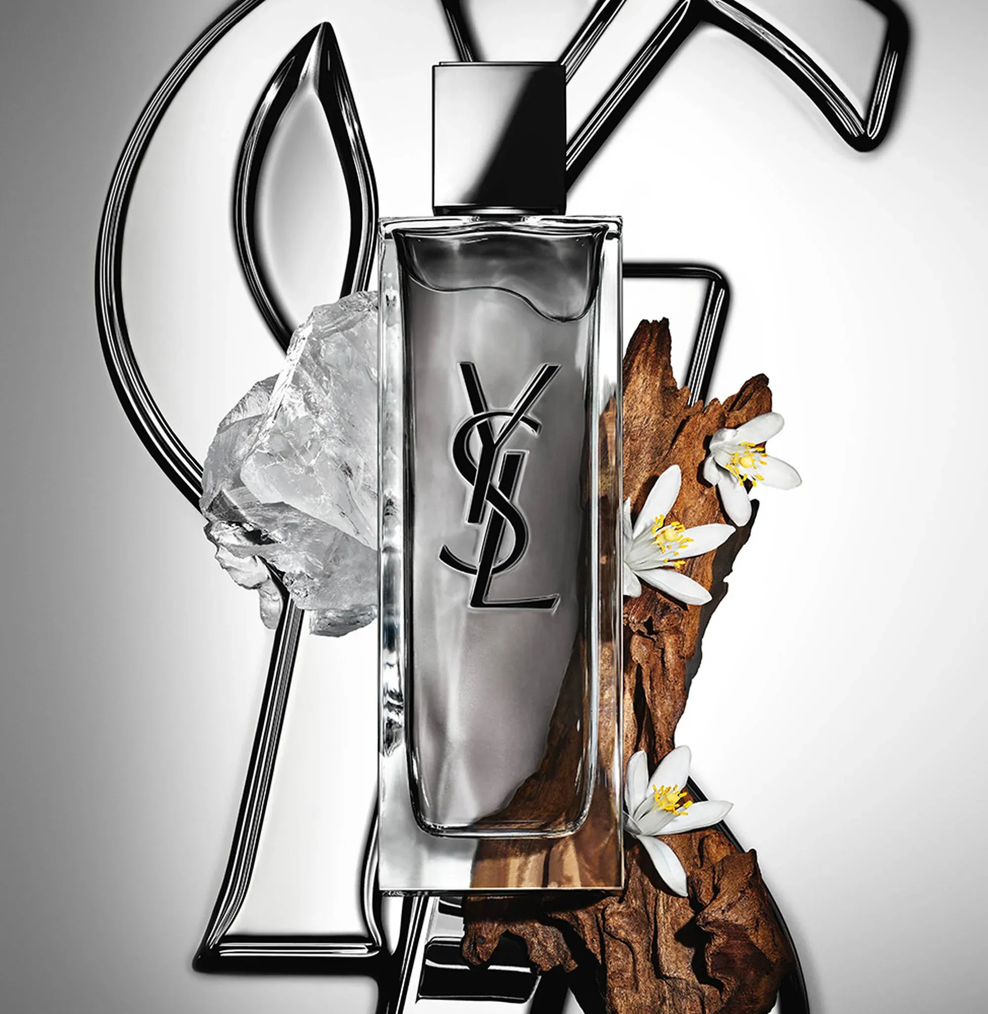 YSL Beauty MYSLF product photo: smoke grey, black cap, chrome and clear glass, glass, studio light