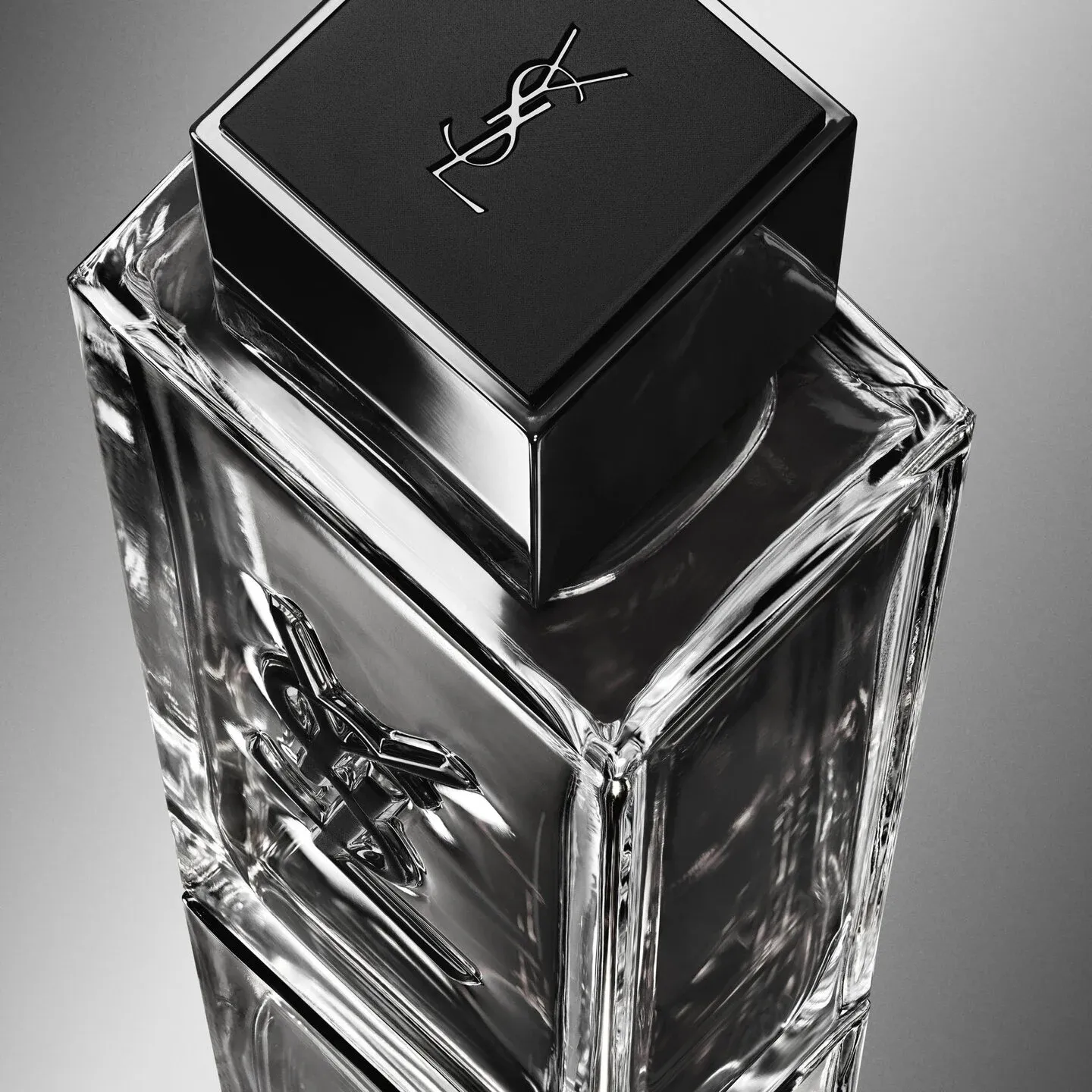 YSL Beauty MYSLF product photo: smoke grey, black cap, chrome and clear glass, glass, studio light, image 3 of 4