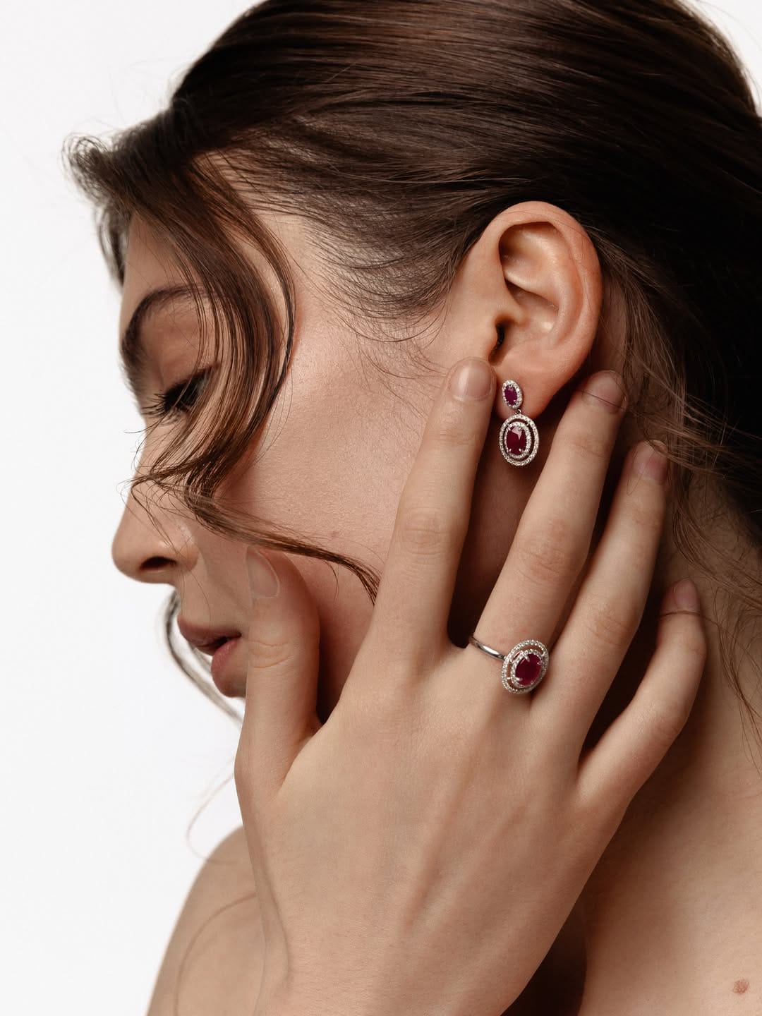 ZARINA Jewelry product photo: white gold and ruby red, skin and organic, soft light, image 3 of 7