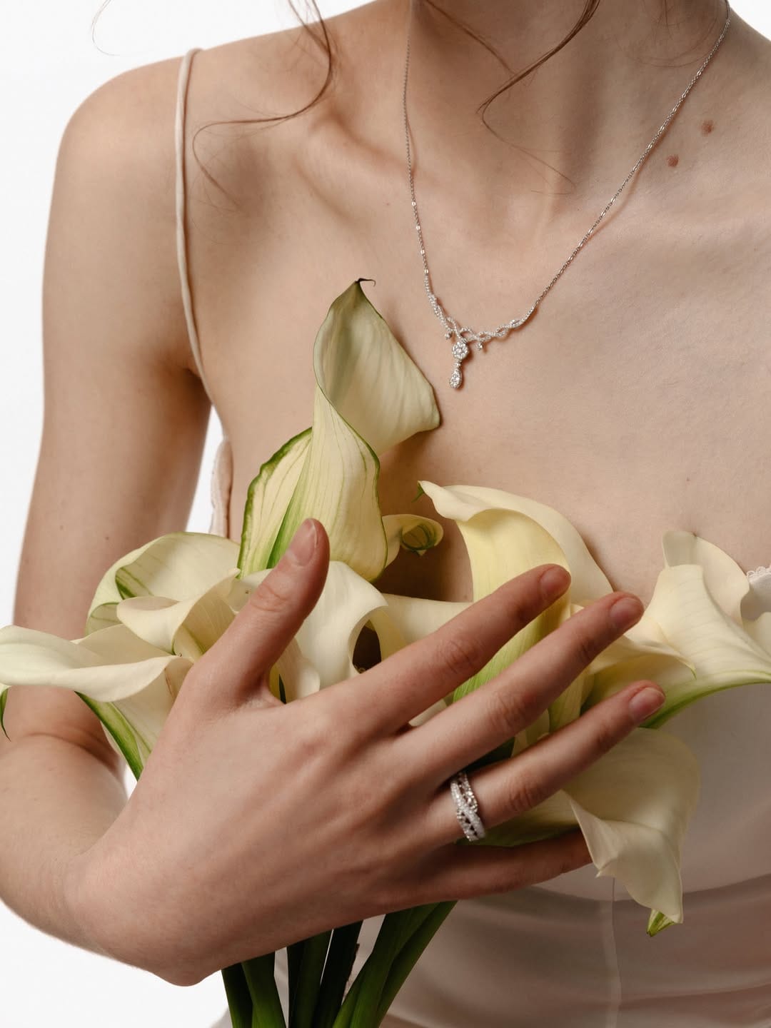 ZARINA Jewelry product photo: white gold and ruby red, skin and organic, soft light, image 4 of 7